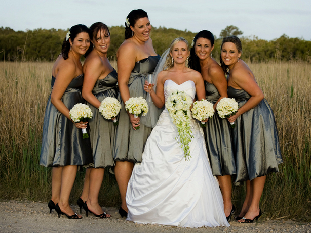  love the sophisticated wedding party posed against the natural backdrop